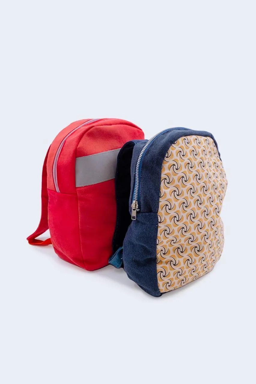Upcycled backpacks in red and printed fabric