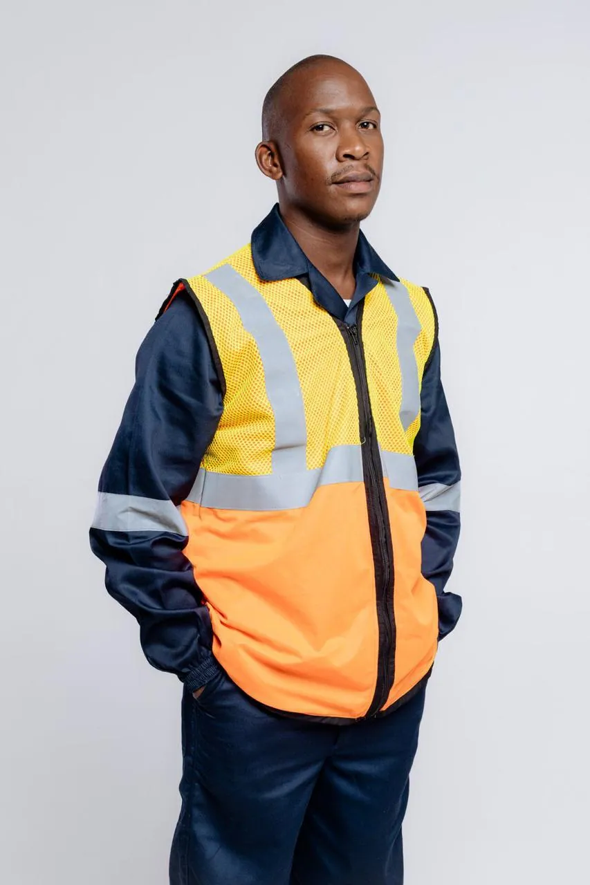 Worker in an orange and yellow hi-vis vest