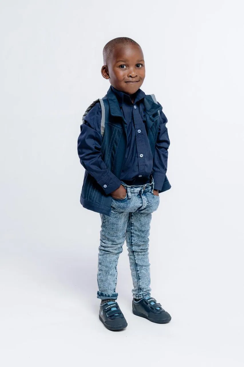 Child in an upcycled denim jacket